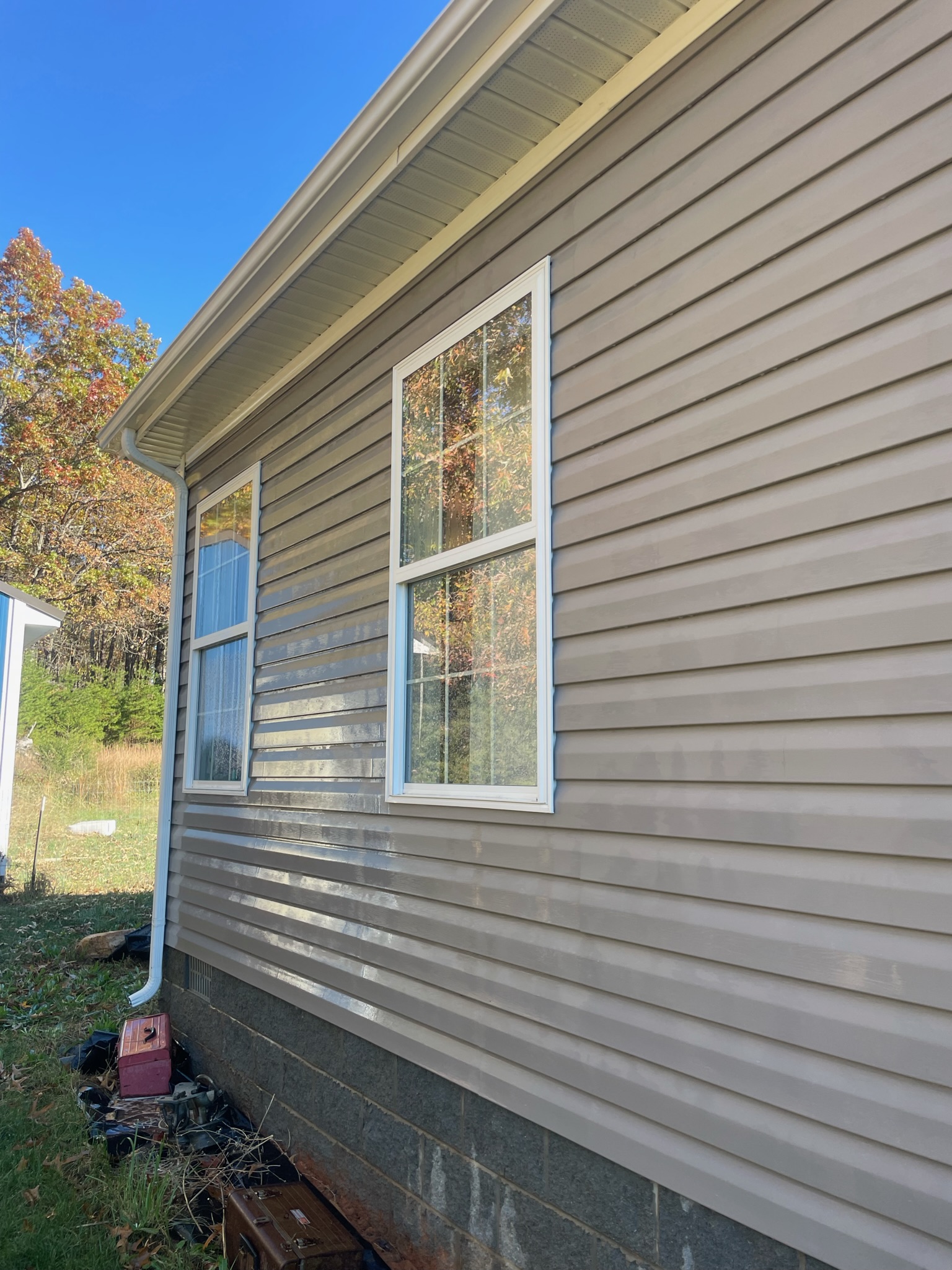 Clean vinyl siding after professional house washing by Grit to Gloss